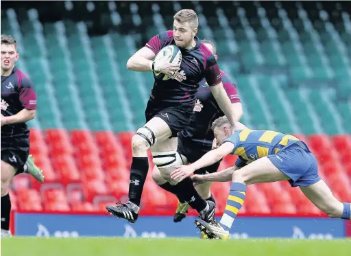  ?? CHRIS FAIRWEATHE­R/HUW EVANS AGENCY ?? Luke Morgan of Bedlinog makes a break during the Swalec Plate final. Bedlinog had a season they will never forget