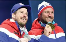  ?? DIMITAR DILKOFF/AFP/GETTY IMAGES ?? Silver medallist Kjetil Jansrud, left, and Aksel Lund Svindal are united on the podium after the men’s downhill on Thursday.