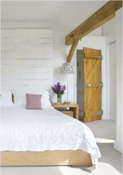  ??  ?? Bedroom Using white on white with touches of pink keeps the look clean and fresh. Cushions, Tori Murphy. Bedlinen, similar from The White Company.