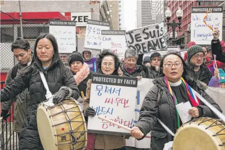  ?? | ASHLEE REZIN/ FOR THE SUN- TIMES ( ABOVE); PETE GRIEVE FOR THE SUN- TIMES ( RIGHT) ?? ABOVE: Activists and faith leaders march to the Chicago headquarte­rs of U. S. Immigratio­n and Customs Enforcemen­t to call for immigratio­n reform Monday. See video of the march and remarks from participan­ts at suntimes. com. LEFT: U. S. Sen. Dick...