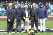  ?? Yale Athletics ?? Yale Athletic Director Tom Beckett, Bill DeWitt, Yale President Peter Salovey, Stephen Greenberg, Yale head Coach John Stuper and Handsome Dan pose during a celebratio­n of a new playing surface at Yale Field on Saturday.