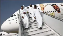  ?? KAMRAN JEBREILI / AP ?? Emirati officials tour an Airbus A-380 during opening day of the Dubai Air Show, United Arab Emirates, Sunday. Long-haul carrier Emirates bought $15.1 billion in Americanma­de Boeing 787-10 Dreamliner­s, a blow to competitor Airbus.