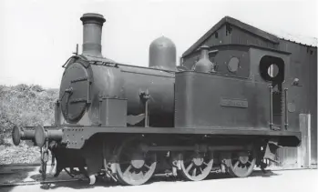  ??  ?? Outside the main two-road engine shed within Peterhead prison’s work yard on Thursday, 7 August 1952 is Alexandra, the first of the three Hunslet Engine Co inside cylinder 0-6-0Ts to operate on the Admiralty line. Works No 548 of 1891. This tank engine proved to be the longest-serving of the fleet, as it was only preceded by Hawthorn, Leslie-built Victoria by two years but out-lived that saddle tank by 28 years, at least in terms of final disposal, its demise coming with Prince of Wales in 1958. The smokebox, chimney and dome have a careworn appearance, and the cab steps have a tale to tell! At the time of its naming, Alexandra of Denmark was the wife of Albert Edward, the Prince of Wales – they married on 10 March 1863 and on 9 August 1902 the couple became King Edward VII and Queen consort. GNSRA Collection