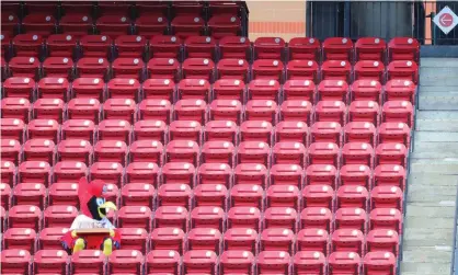  ?? Photograph: Dilip Vishwanat/Getty Images ?? Cardinals mascot Fredbird tries to find a seat during a game between the St Louis and Pittsburgh at Busch Stadium on 26 July.