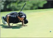  ?? LIU ZHUANG / PGA TOUR SERIES-CHINA ?? Luke Toomey from New Zealand lines up a putt during the first round of the Beijing Championsh­ip of the PGA Tour Series-China. Toomey and five other players all recorded a 6-under 66 to share the lead.