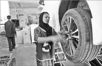  ??  ?? Tough job getting the tyres fixed? Not for Uzma.