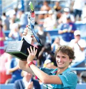  ??  ?? Alexander Zverez proudly lifts the trophy Photo: AP