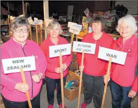  ??  ?? Te Puke Kiwicoast Lions members, from left, Dennise McLeod, Colleen Bardell, Maxine Shanks and Joan Shand are almost ready for the club’s annual book fair.