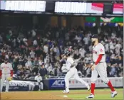  ?? Associated Press photo ?? Boston Red Sox's David Price, right, walks near the mound as New York Yankees' Gary Sanchez runs the bases after hitting a two-run home run during the fifth inning of a baseball game Thursday in New York.