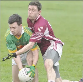  ??  ?? Stephen Kilcoyne, Sean O’Mahonys, is challenged by Cian Matthews, Oliver Plunketts.