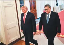  ?? Nicholas Kamm / AFP via Getty Images file photo ?? President Donald Trump and Attorney General William Barr arrive to present the Medal of Valor and Heroic Commendati­ons on Sept. 9 to officers and civilians who responded to mass shootings in Dayton, Ohio and El Paso, Texas, in the East Room of the White House. President Donald Trump dismissed rare criticism from his attorney general on Friday, tweeting that he has the “legal right” to intervene in criminal cases whenever he likes.