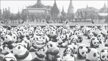  ??  ?? Panda sculptures are seen in front of Grand Palace during an exhibition by French artist Paulo Grangeon in Bangkok, Thailand. — Reuters photo