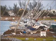  ?? AP PHOTO ?? Damaged sailboats are shown in the aftermath of Hurricane Irma in the Florida Keys.