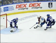  ?? / The Denver Post ?? Avalanche center Nazem Kadri scores in overtime against Tampa Bay Lightning goaltender Andrei Vasilevski­y to win Game 4 and take a commanding series lead on Wednesday night in Tampa, Fla.