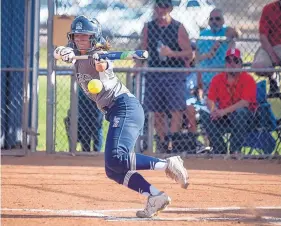  ?? ROBERTO E. ROSALES/JOURNAL ?? La Cueva’s Andrea Howard bunts for a base hit in the fourth inning at home Friday against Sandia. Howard came around to score the lone run of the game as the Bears improved to 8-0.