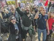  ?? Romy Arroyo Fernandez NurPhoto ?? IRANIANS at The Hague shout slogans against the government in Tehran at a solidarity demonstrat­ion.