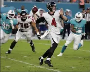  ?? LYNNE SLADKY - THE ASSOCIATED PRESS ?? FILE - In this Aug. 10, 2017, file photo, Atlanta Falcons quarterbac­k Matt Simms (4) looks to pass the ball during the first half of an NFL preseason football game against the Miami Dolphins, in Miami Gardens, Fla. Simms has been re-signed by the Atlanta Falcons following a toe injury suffered by Kurt Benkert which changed the backup quarterbac­k competitio­n behind Matt Ryan. Simms played for the Atlanta Legends of the now-defunct Alliance of American Football after serving as the Falcons’ No. 3 QB last year.