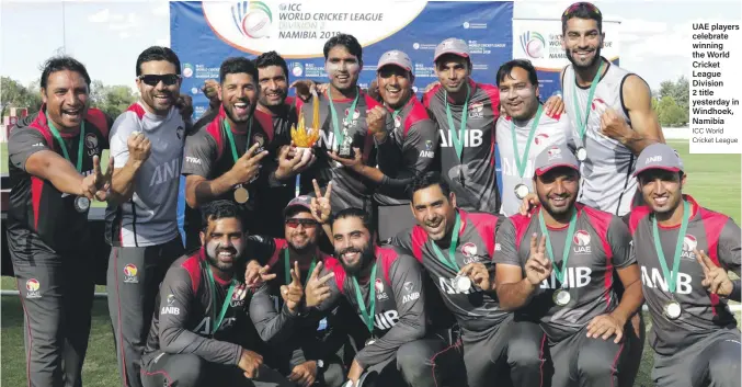  ??  ?? UAE players celebrate winning the World Cricket League Division 2 title yesterday in Windhoek, Namibia