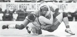  ??  ?? South Carroll's Jamar Williams takes down Perryville's Eugene Zacerous on the way to winning their 170-pound Class 2A-1A final in the state tournament.