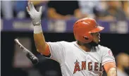  ?? CHRIS O'MEARA/ASSOCIATED PRESS ?? Luis Valbuena flips his bat after hitting a single for the Angels against Tampa Bay in the fourth inning.