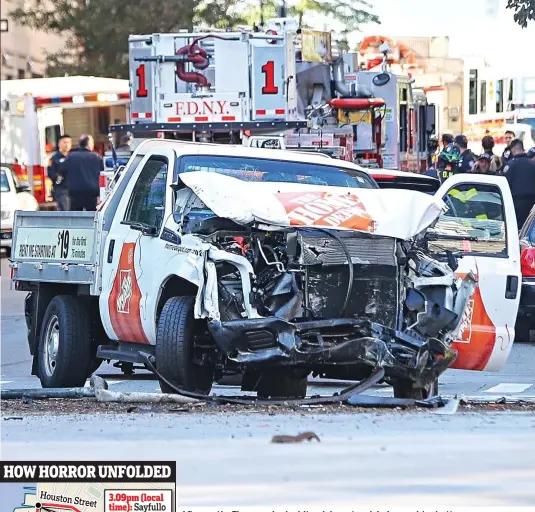  ??  ?? Aftermath: The wrecked white pick-up truck in Lower Manhattan