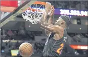  ?? LYNNE SLADKY — THE ASSOCIATED PRESS ?? Heat forward Jimmy Butler dunks during the second half against the Wizards on Thursday. The Heat won 112-97.