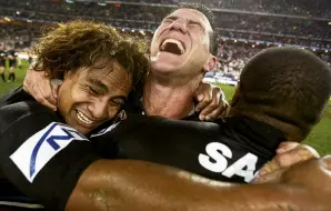  ?? PHOTO: GETTY IMAGES ?? Pure joy . . . Sattler (centre) screams in delight as he embraces Penrith Panthers teammates Joe Galuvao (left) and Rhys Wesser after winning the 2003 NRL grand final in Sydney.
