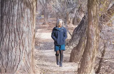  ?? GREG SORBER/JOURNAL ?? Laura McCarthy walks through the Rio Grande bosque in Albuquerqu­e. McCarthy and her team have assembled a group of about 70 businesses and government agencies in their race to head off devastatin­g wildfires and their disastrous impact on our water.