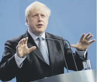  ??  ?? 0 Boris Johnson holds a joint press conference with German Chancellor Angela Merkel in Berlin yesterday, ahead of talks to try to break the Brexit deadlock