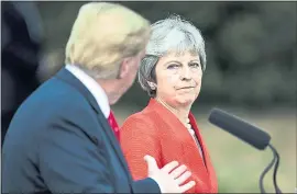  ?? JACK TAYLOR — POOL PHOTO VIA AP ?? British Prime Minister Theresa May and President Donald Trump answer questions during a joint news conference after their meeting in Buckingham­shire, England, on Friday.