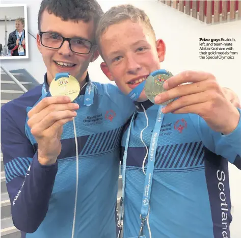  ??  ?? Prize guysRuairi­dh, left, and team-mate Alistair Graham with their gold medals from the Special Olympics