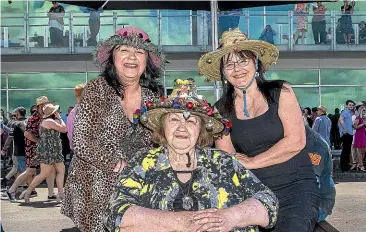  ?? WARWICK SMITH/STUFF ?? Mother and daughters sporting their self-decorated Christmas-themed hats, from left; Vikki Tait, 60, Bev Rauhihi, 78, and Sandra Tait, 61.