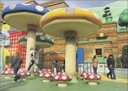  ?? Dania Maxwell Los Angeles Times ?? GIANT mushrooms and more await at Universal Studios’ Super Nintendo World.