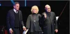  ?? KENNETH CHOU ?? Composer Philip Glass receives the Glenn Gould Prize at a gala concert in his honour. From left, Glass, Petula Clark and Dennis Russell Davies.