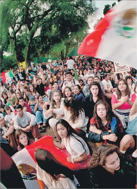  ??  ?? HIGH SCHOOL students gather in Plaza Park in Oxnard to protest Propositio­n 187 on Oct. 28, 1994. Many Latinos, including legal residents, saw the initiative as an existentia­l threat and participat­ed in some of the largest protests California had seen since the Vietnam War.