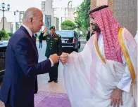  ?? The Saudi Royal Palace via AP ?? ■ Saudi Crown Prince Mohammed bin Salman, right, greets President Joe Biden with a fist bump after his arrival at the royal palace in Jeddah, Saudi Arabia.