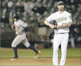  ?? JANE TYSKA — STAFF ?? Reliever John Axford and the A’s haven’t had much fun this year. They are headed to their third consecutiv­e season of 90-plus losses.