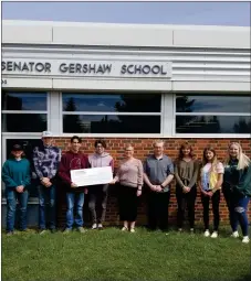  ?? ?? Left to right: Hayden Meyer, Curtis Duffhues , Kason Muller, Alan Janzen, Karen Saffran from Praxis Science Outreach Society, Ayden Rooks, Tori Rooks, Rianne Van Der Haar, and Trista Smith stand with their cheque from the CFSEA, given to Praxis as part of the Youth in Philanthro­py program.