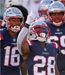  ?? MATT STONE PHOTOS / HERALD STAFF FILE ?? LONGEST OF SEASONS: James White celebrates after scoring a touchdown against the Arizona Cardinals. Below, Lawrence Guy, who will be a free agent after the season, said he would be open to returning to the Patriots.