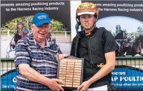  ?? ?? TOP POINTS: Decron Horse Care principal Merv Butterwort­h presents Horsham’s Noel Smith Memorial shield to Jack Laugher, winner of the 2022 Horsham Invitation Drivers Championsh­ip.