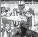  ?? Arkansas Democrat-Gazette/BENJAMIN KRAIN ?? Arkadelphi­a’s Dillon Scott, shown leaping over a Warren defender, had a game-saving tackle and intercepti­on in the final seconds.