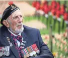  ?? LEON NEAL/GETTY IMAGES ?? World War II veteran Joe Cattini is interviewe­d as he visits the 94th Field Of Remembranc­e at Westminste­r Abbey on Friday in London. Alberto Joseph Cattini, known as Joe, served for five years from 1941, before taking part in the Normandy landings.