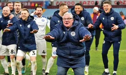  ?? Photo: AP ?? Stevenage boss Steve Evans (front) celebrates the victory over Villa during their match on January 9, 2023.