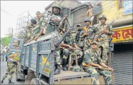  ?? SAMIR JANA/HT ?? Paramilita­ry forces patrol the violencehi­t Basirhat in West Bengal on Saturday.