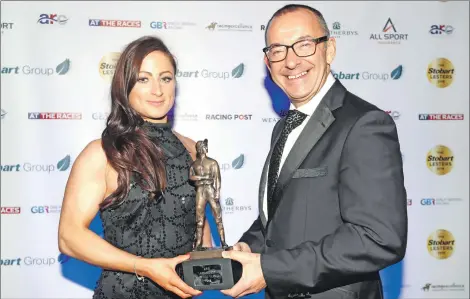  ?? Photograph by Dan Abraham - focusonrac­ing.com ?? Rod Street, chief executive of Great British Racing Ltd, presents Nicola Currie with the Lady Jockey of the Year trophy at the Stobart Lesters.