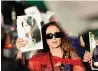  ?? ?? Dr Soraya Fallah, an Iranian Kurd from Saqqez living in Los Angeles, demonstrat­es while holding a picture of Mahsa (Zhina) Amini at a protest in Los Angeles, California. — reuters file
