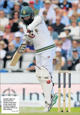  ?? Picture: AFP ?? STEADY DOES IT: South Africa’s Hashim Amla bats in the fourth Test between England and South Africa at Old Trafford