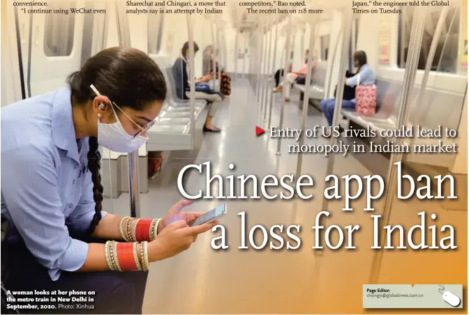  ?? Photo: Xinhua ?? A woman looks at her phone on the metro train in New Delhi in September, 2020.