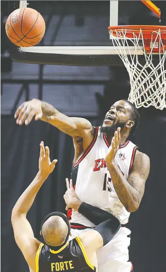  ?? DAN JANISSE ?? Sam Muldrow of the Windsor Express blocks a shot by Cameron Forte of the London Lightning during their game on Wednesday at the WFCU Centre, which ended in a 125-121 Lightning victory.