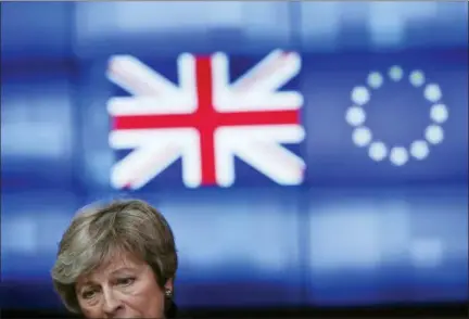  ?? FRANCISCO SECO — THE ASSOCIATED PRESS ?? Britain’s Prime Minister Theresa May talks to journalist­s after her meeting with European Council President Donald Tusk at the European Council headquarte­rs in Brussels, Thursday.